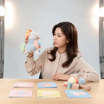 Sassy developmental product curator reviewing toy textures